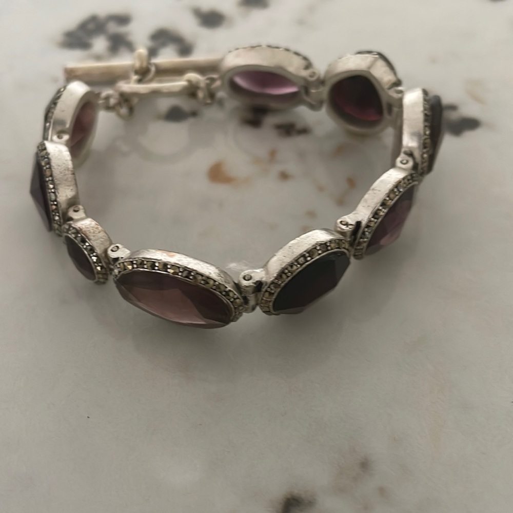 Kenneth Cole multi amethyst color bracelet rhinestones and silvertone toggle.